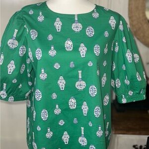 Green Shirt with Blue and White Vase Print